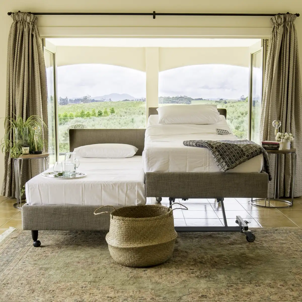 Dual King ICARE Homecare Premium Beds next to each other in a Tuscany room with one base lifted