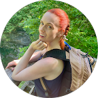 Google profile image of Naomi Morningstar; a smiling woman with bright red hair in a braid.